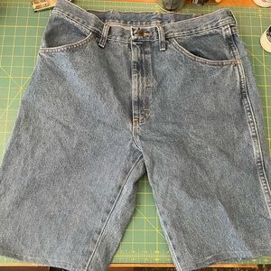 Rustler jeans cut and hemmed into jorts.